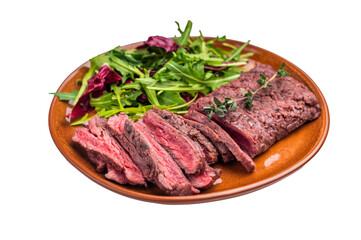 Fototapeta premium Grilled Skirt machete beef steak, roasted sliced meat on plate with salad isolated on white background. top view