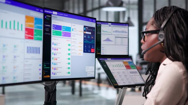 Call Center Agent Monitors Customer Service Dashboard Using Laptop
