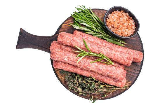 Balkan raw Cevapcici Sausage, fresh Cevapi from mince beef and pork meat isolated on white background. top view