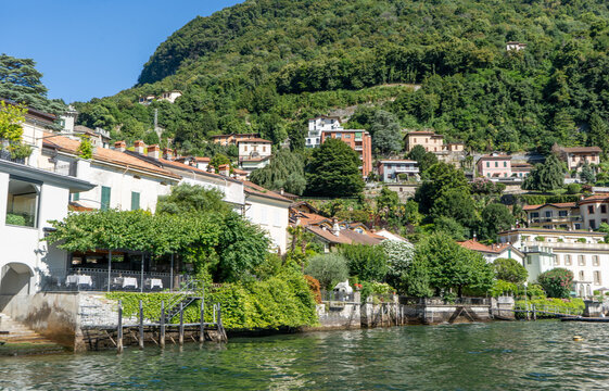 Villa houses building old architecture on lake Como Italy city on water.