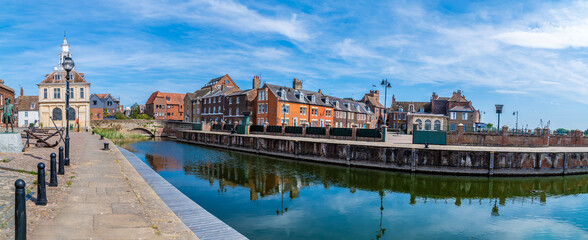 Fototapeta premium A panorama view along the quayside across Purfleet Quay in King's Lynn, Norfolk, England in summertime