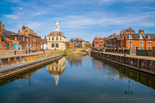 A view down the quayside of Purfleet Quay in King's Lynn, Norfolk, England in summertime