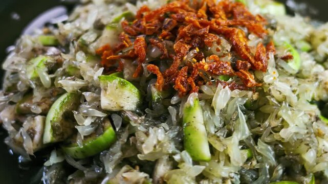 Slow Motion Rotating Shot of Spicy Northern Thai Pomelo Salad with Crab Paste