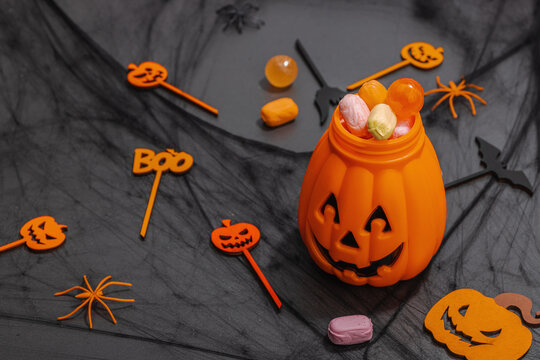 Traditional festive composition for Halloween party. Sweet seasonal food, homemade autumn decor