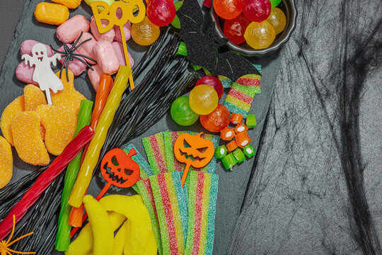 Traditional festive composition for Halloween party. Sweet seasonal food, homemade autumn decor