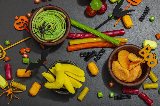 Traditional festive composition for Halloween party. Sweet seasonal food, homemade autumn decor