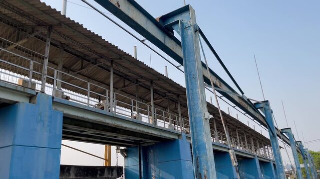Side Angle View of Water Gate Control Building with Heavy Steel Beam Construction