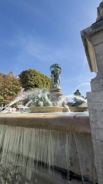 Bronze sea horses and celestial globe crown Carpeaux fountain, Paris