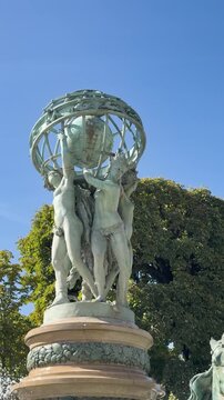 Bronze sea horses and celestial globe crown Carpeaux fountain, Paris