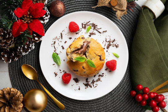 Top-down view of an American-style cookie filled with cocoa cream. Traditional Spanish recipe. Christmas treat with festive decorations.