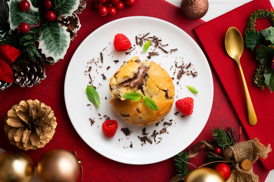 Top-down view of an American-style cookie filled with cocoa cream. Traditional Spanish recipe. Christmas treat with festive decorations.