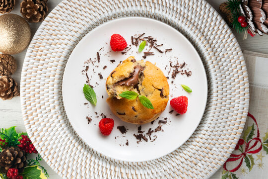 Top-down view of an American-style cookie filled with cocoa cream. Traditional Spanish recipe. Christmas treat with festive decorations.