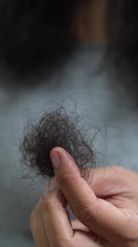 young woman her hair and have many hair loss. problem of maintenance losing by sad strain cancer patients after receiving chemotherapy. Healthcare and medical concept.	