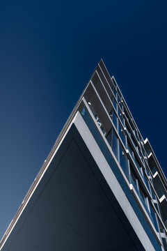 bottom up architectural view on modern residential building against clear sky on sunny day, Abu Dhabi