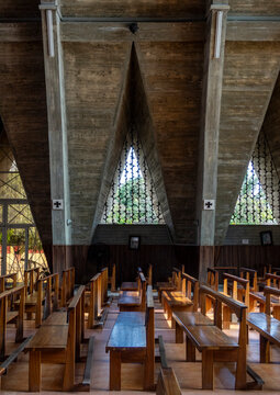 Triangular concrete roof structure and pews inside the Cathedral of Our Lady of Fatima, Benguela Province, Benguela, Angola