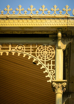 A wrought-iron finial spike rises above the fleur-de-lis cornice at the corner of the Palacio de Ferro, Luanda Province, Luanda, Angola