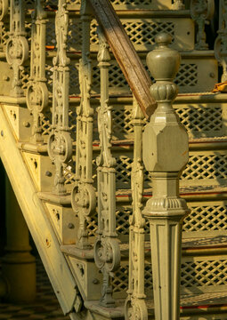 Ornate cast-iron staircase balusters and a wooden handrail lead up to the Palacio de Ferro, Luanda Province, Luanda, Angola