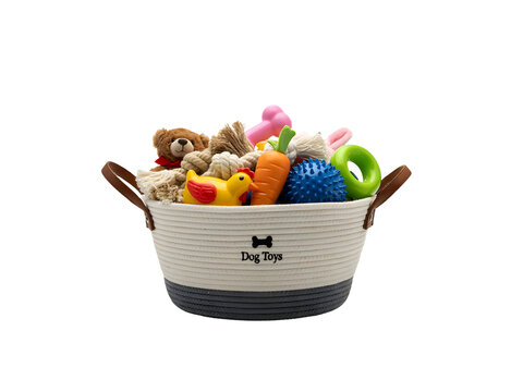 Dog toy basket filled with colorful pet accessories. Features rubber chicken squeaky ball rope and plush teddy bear on white background