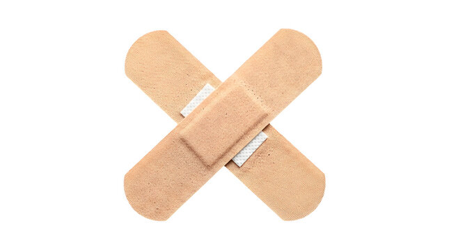 Two adhesive bandages arranged in a cross shape isolated on a transparent background
