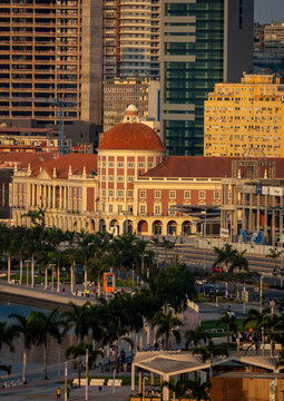 Colonnaded facade and red dome of the Banco Nacional de Angola stand among skyscrapers along Luanda Bay, Luanda Province, Luanda, Angola