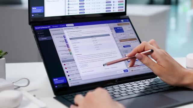 Grant Manager Reviews Nonprofit Funding Dashboard