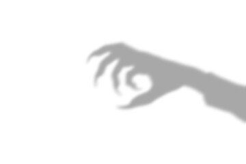 A dark scary shadow of a clawed hand reaching out representing a monster or ghost silhouette isolated on transparent background isolated on transparent background © AHAMMED