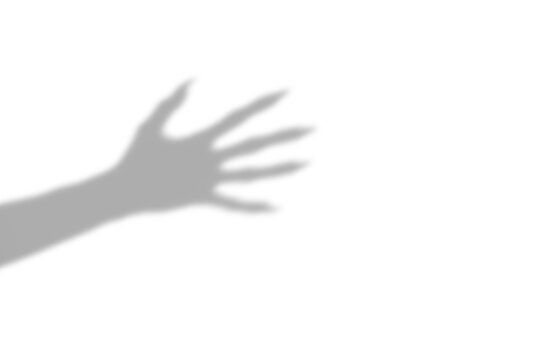 A dark silhouette of a scary monster hand with long sharp claws reaching out cast as a shadow isolated on transparent isolated on transparent background