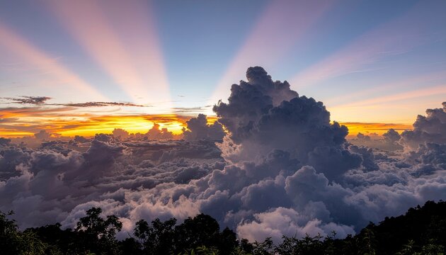 Celestial Symphony Above the Clouds: A breathtaking sunrise paints the sky with hues of orange and gold, piercing through dramatic cumulonimbus clouds.