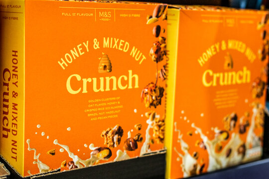 Close-Up Of Marks And Spencer Own Brand Honey And Mixed Nut Crunch Breakfast Cereal Boxes