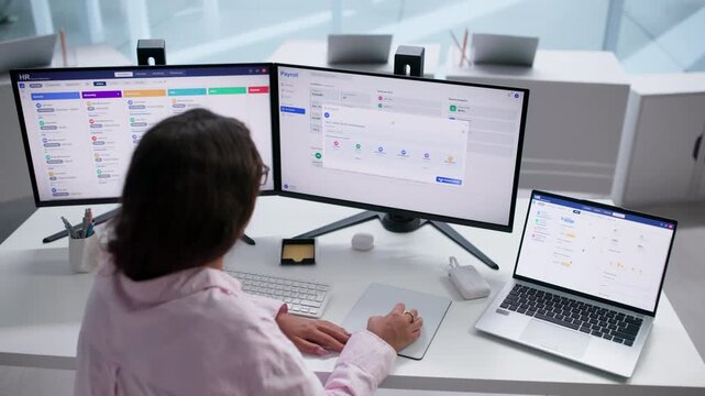 Payroll Manager Reviewing Employee Salary Details
