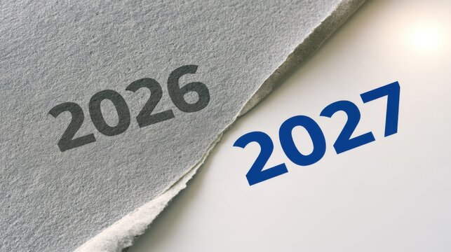 Torn paper revealing the year 2027 beneath the year 2026, showcasing a transition from one year to the next in a clean, minimalistic design