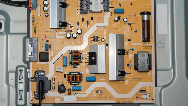 Top view of power supply circuit board with electronic components inside TV