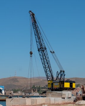 Work barge with crane in Sigri in western Lesbos island, Greece.