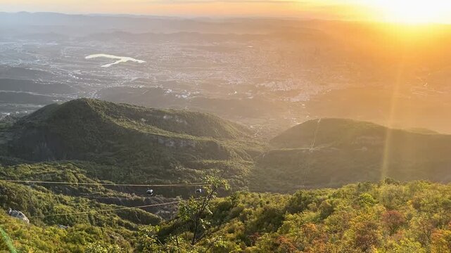  A beautiful panoramic view of the lush green mountains and hills of Mount Dajti National Park near Tirana, Albania. The video captures the scenic landscape during a bright sunny day with a cable car 