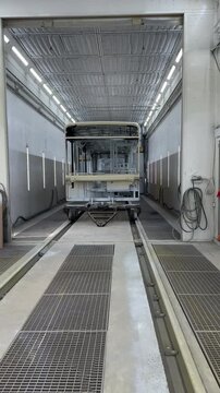Spray paint shop for tram carriages. Train Paint Booth Painting Chamber For Railway Carriage. Railway Paint Both. Inside of rail car assembly plant, paint shop. Tram workshop production. 