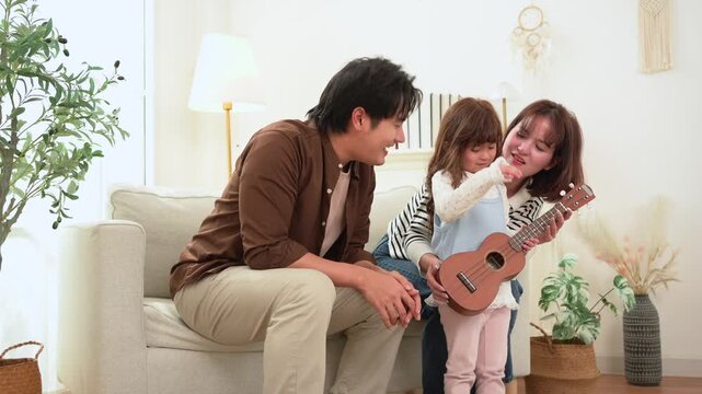 Family Enjoys Music Together in Living Room During Daytime