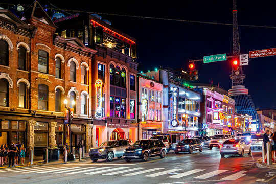 Late night view of the colorfully illuminated Broadway Street, the central hub of the Honky Tonk Highway entertainment district in downtown Nashville, Tennessee, July 9 2025.