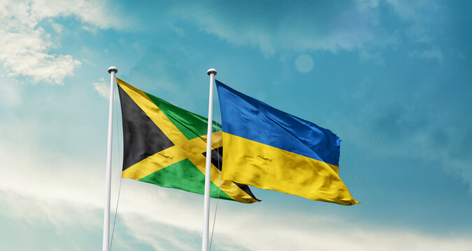 Jamaica Ukraine friendship flags are waving in the sky. Two country flag for agreement or deal. Jamaica Ukraine national flag for commitment.