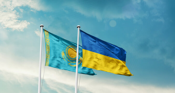 Kazakhstan Ukraine friendship flags are waving in the sky. Two country flag for agreement or deal. Kazakhstan Ukraine national flag for commitment.