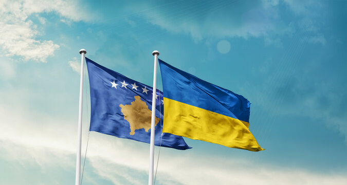 Kosovo Ukraine friendship flags are waving in the sky. Two country flag for agreement or deal. Kosovo Ukraine national flag for commitment.