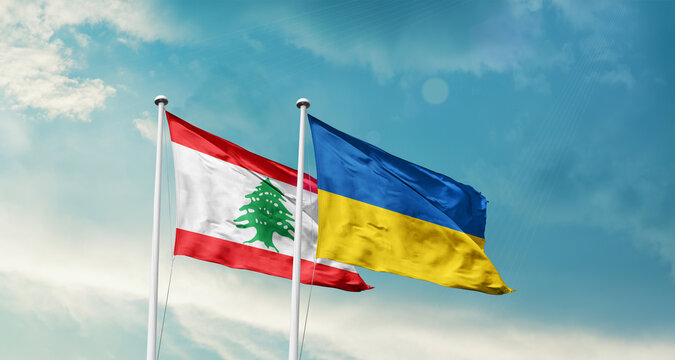 Lebanon Ukraine friendship flags are waving in the sky. Two country flag for agreement or deal. Lebanon Ukraine national flag for commitment.