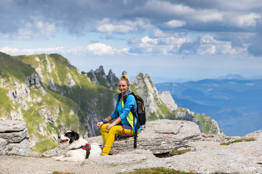 trekking with a dog in high mountains