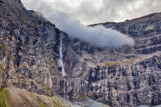 French Pyrenees dramatic mountain landscape. Cirque de Gavarnie mountain valley in Pyrenees National Park (French: Parc national des Pyrenees).