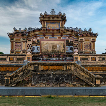 The historic Hue War Memorial, an ornate monument in the former imperial city of Hue, Vietnam, featuring detailed stonework, stairs, and traditional Indochinese architectural design