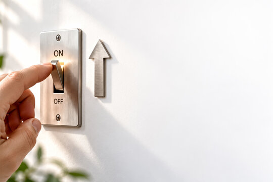 Hand switching a metal ON OFF control with an upward arrow, symbolizing activation, growth, progress, change and business decisions.