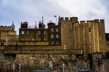 Historic castle walls under cloudy sky © Novanture