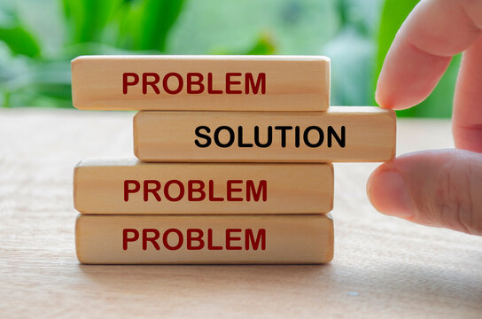 Wooden blocks labeled solution representing strategic thinking, planning, and effective problem resolution.