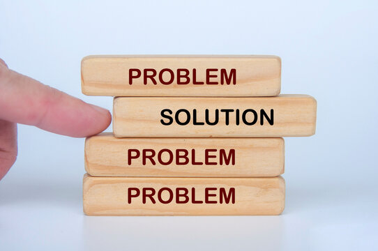 Stacked blocks showing solution overcoming multiple problems and challenges.