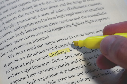 Challenge word highlighted in a book page.