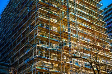 Building under construction with scaffolding © Novanture